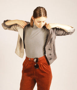 Cropped Split Tone Blazer. The cropped two-tone blazer is a capsule piece for every powerhouse woman. The linen makes for a light and breathable blazer, which perfectly compliments a pair of high waisted suit trousers.