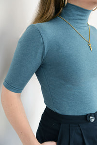 Air Turtleneck. A classic wardrobe staple, this short sleeved turtle neck is cut from organic cotton. The soft & stretchy material elegantly silhouettes your figure and can be easily dressed up or down. 