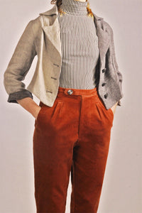 Cropped Split Tone Blazer. The cropped two-tone blazer is a capsule piece for every powerhouse woman. The linen makes for a light and breathable blazer, which perfectly compliments a pair of high waisted suit trousers.