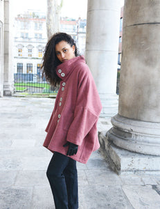 Spring Coat in Rose. Inspired by the high-neck coats from the 1960s, this Spring coat is a chic addition to any wardrobe looking for a splash of colour. It's an ideal top layer to throw over a t-shirt on a sunny day or to throw over layers during the colder seasons. 