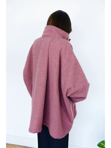 Spring Coat in Rose. Inspired by the high-neck coats from the 1960s, this Spring coat is a chic addition to any wardrobe looking for a splash of colour. It's an ideal top layer to throw over a t-shirt on a sunny day or to throw over layers during the colder seasons. 