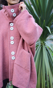 Spring Coat in Rose. Inspired by the high-neck coats from the 1960s, this Spring coat is a chic addition to any wardrobe looking for a splash of colour. It's an ideal top layer to throw over a t-shirt on a sunny day or to throw over layers during the colder seasons. 